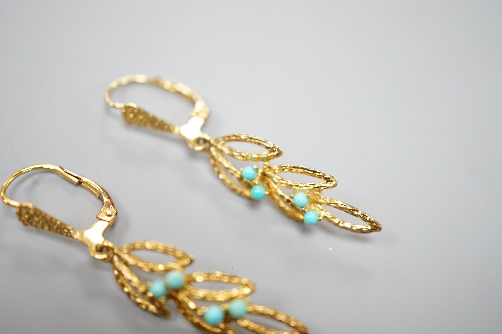 Two modern pairs of 14ct and gem set earrings, one with mabe pearl (a.f.) and one with turquoise, gross weight 7.1 grams.